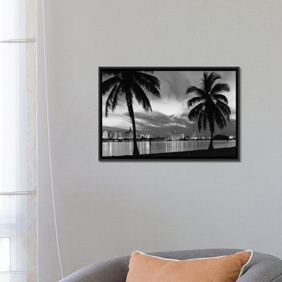 " 1950s Night Skyline View Across The Bay Two Palm Trees Silhouetted In Foreground Miami Florida USA " by Vintage Images
