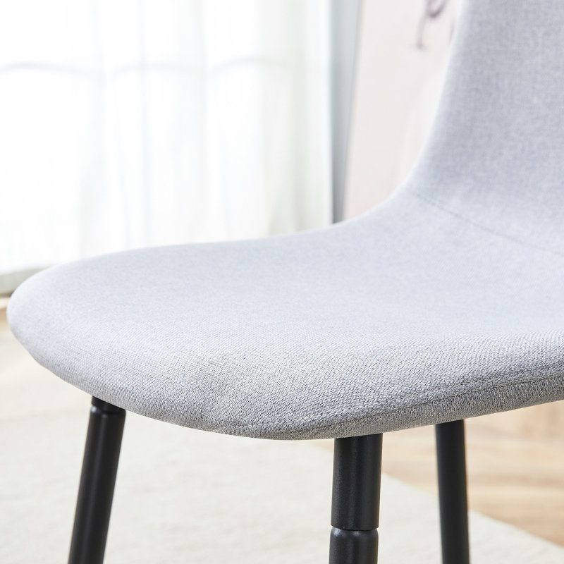 Table de salle à manger à motif de marbre noir 63 po x 35,4 po avec 4 chaises en tissu de lin gris - utilisation spacieuse et élégante de l'espace moderne