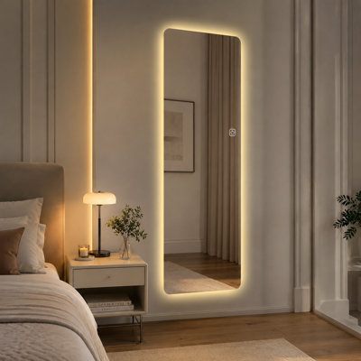 Wall-mounted 65" x 21" full-length mirror with lights; features three-color lighting and adjustable brightness—a smart decorative mirror for bedrooms and walk-in closets.