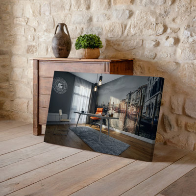 Toile d'un intérieur de bureau moderne avec un bureau minimaliste élégant avec art mural, une élégante chaise en cuir orange placée contre un art mural