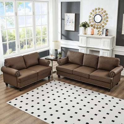 American Classic 2 + 3 places et cuir de vache brun, accoudoirs ronds avec embellissement clouté, structure en bois massif, sièges en éponge à haute élasticité, housses amovibles, rangement sous les sièges 2 + 5 et dans la conception