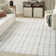 Tysie Geometric Machine Washable Cotton Area Rug in Ivory/Black