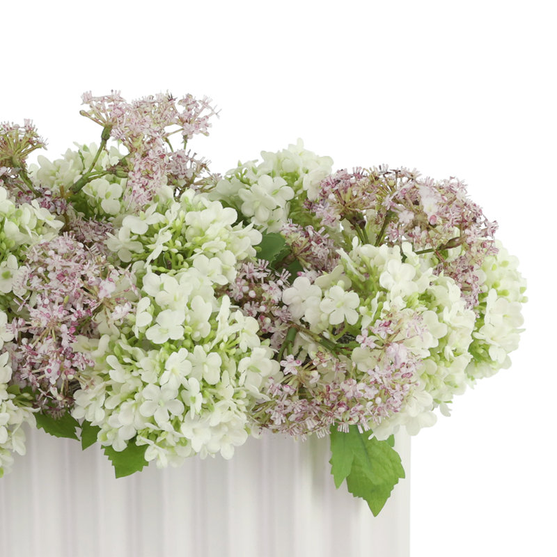 Viburnum and Weeping Laurel Arranged in a Ceramic Vase
