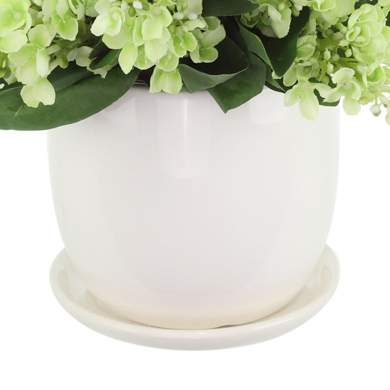 Lilacs Arranged in a Ceramic Pot