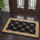Tapis oriental noir / or Clarence