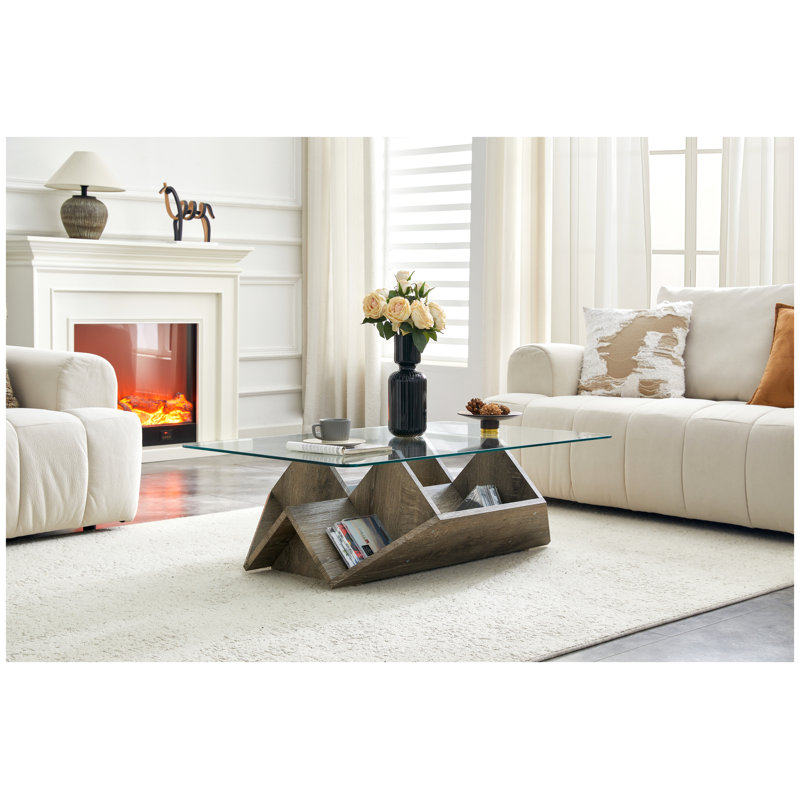 Table basse moderne en verre trempé avec base en bois aggloméré sculpté et compartiments ouverts multi-rangements pour le salon