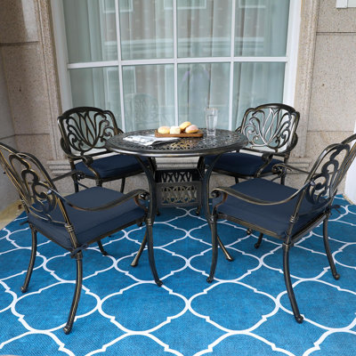 4 - Person Patio Dining Set with Round Table , Cushions Included