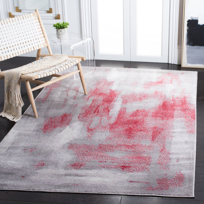 Tapis gris / rouge à motif abstrait