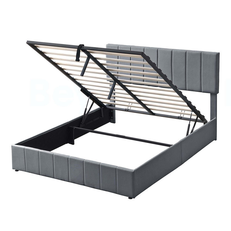 Grand lit plateforme tapissier avec système de rangement hydraulique en gris pour les chambres modernes et le rangement supplémentaire.
