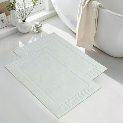 Tapis de bain 100% coton à bordure géométrique 