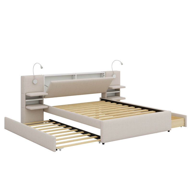 Grand lit plateforme tapissier équipé de lampes de lecture intégrées, de tiroirs et d'un lit gigogne