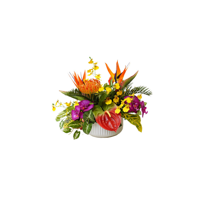 Arrangement floral tropical tropical dans un bol blanc nervuré