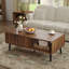 Table basse 47,2 po Caya avec 2 tiroirs cannelés et pieds en bois massif