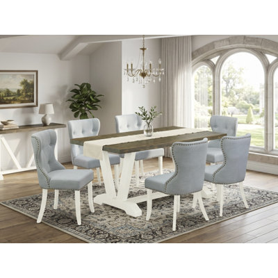 Cet ensemble de table moderne 7 pièces comprend une table de cuisine Jacobean patinée et 6 chaises rembourrées en tissu bleu lin avec dossier capitonné - Lin brossé blanc.