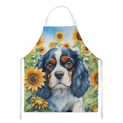 Épagneul cavalier en tablier tournesols