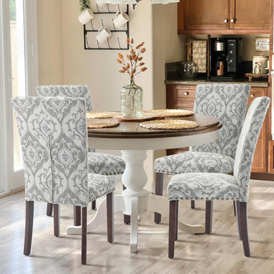 Ensemble de 4 chaises de salle à manger rembourrées en tissu Parsons avec garniture cloutée et pieds en bois - fleur gris / blanc