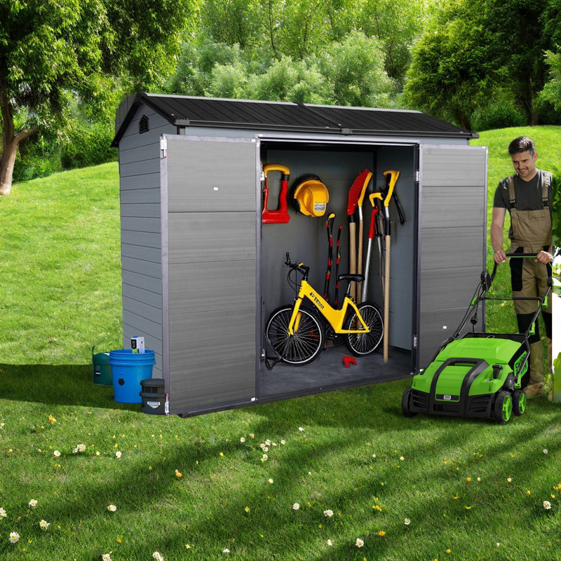 Remises extérieures en résine durable, design noir et gris, pour le jardin et le rangement