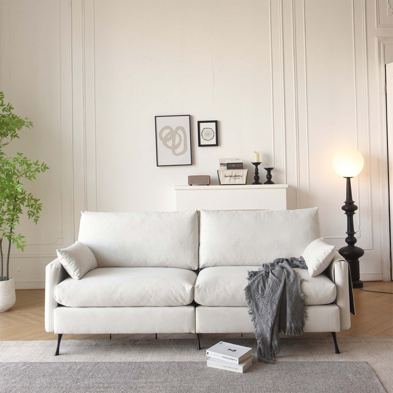 Causeuse confortable et fonctionnelle avec coussins et accoudoirs de rangement supplémentaires pour des heures de détente et des espaces de vie bien rangés