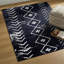 Tapis noir Thambiah-354534932