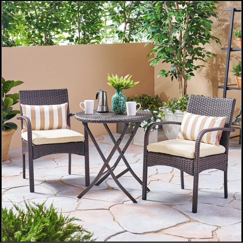 Bistro, with two upholstered chairs and a table, all wrapped in high quality wicker