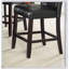 Ensemble de salle à manger à hauteur de comptoir contemporain 6 pièces avec table en faux marbre, rangement et sièges capitonnés en similicuir noir