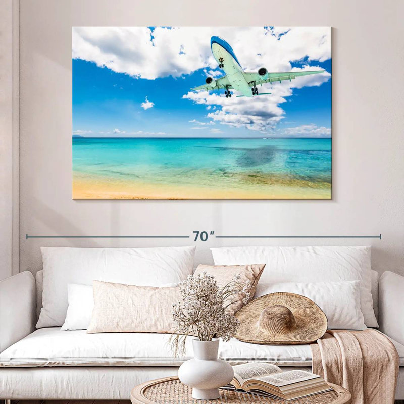 Avion au-dessus de la plage, H 34 po x l 51 po