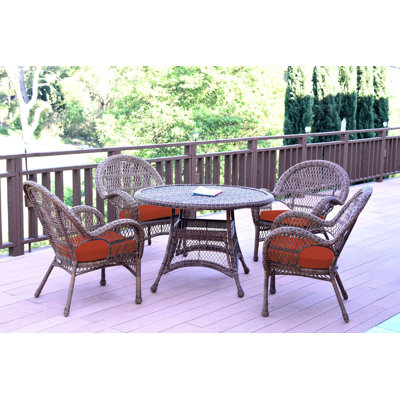 Mangum 4 - Person Wicker Patio Dining Set with Round Table
