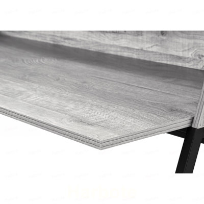 Bureau d'ordinateur, pour bureau à domicile, avec étagères de rangement pour ordinateur portable, 122 cm (48 po), plateau en stratifié gris et structure en métal noir.