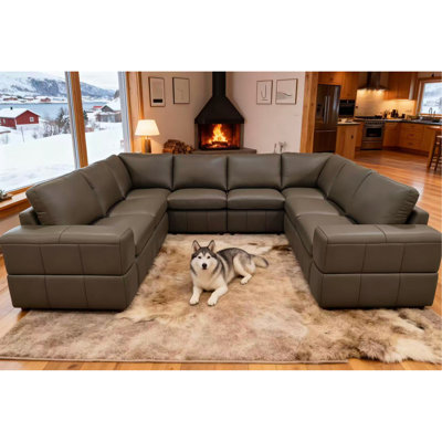 Canapé modulaire à large accoudoirs en cuir assorti