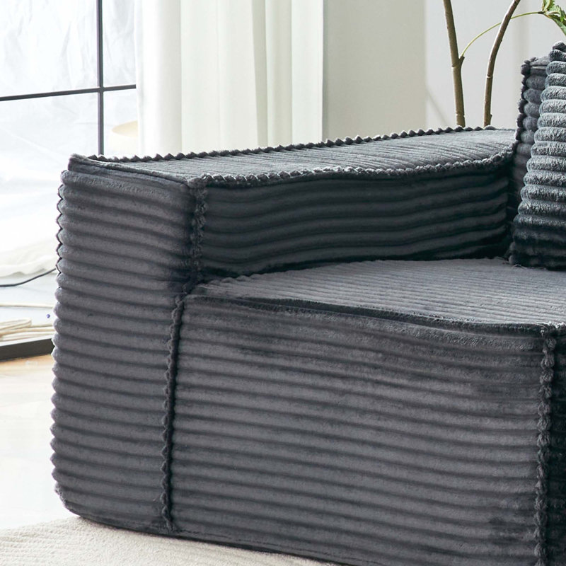 Canapé modulaire en forme de L Boneless avec repose-pieds, mousse haute densité et revêtement en velours côtelé rayé pour la maison ou le bureau.