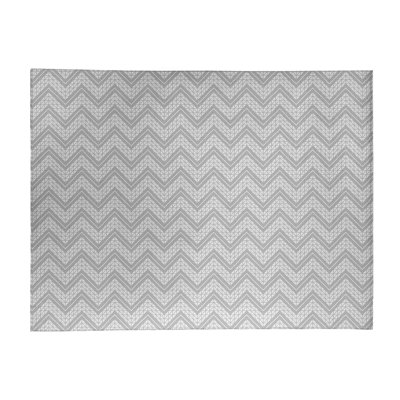 Tapis gris/blanc à chevrons à la main