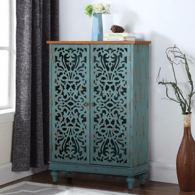 Ezzell Solid and Manufactured Wood 2-Door Accent Cabinet with Hollow-Carved Doors