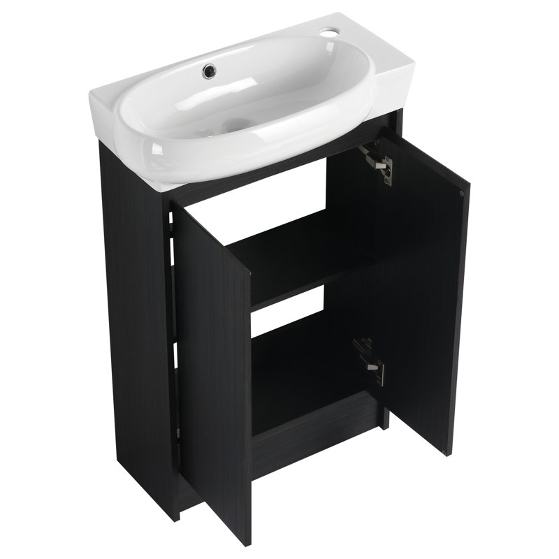 Meuble-lavabo de 23 po avec lavabo. Style compact et moderne. Performance de la porte à fermeture en douceur. Vaste espace de rangement. Aspect châtaignier noir. Lavabo sur meuble, autoportant