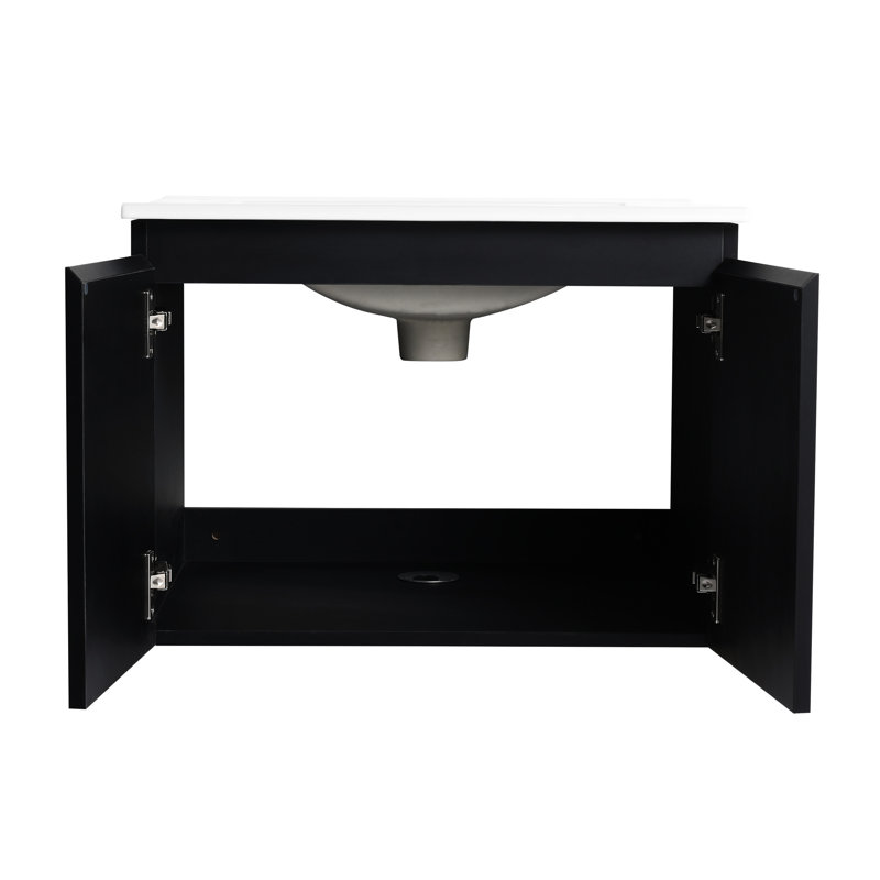 Meuble-lavabo mural 24 po. Armoire noire en contreplaqué avec porte à fermeture en douceur qui fonctionne sans effort. Lavabo en céramique pour un meuble-lavabo moderne. Fonctionne parfaitement