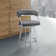Dehn Modern Swivel Counter or Bar Height Barstool with Open Back and Footrest in Metal and Faux Leather