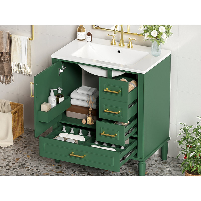 Meuble de salle de bain de 76 cm avec trois tiroirs, portes à fermeture amortie, lavabo en céramique, poignées dorées, rangement compact, espace de bain optimisé