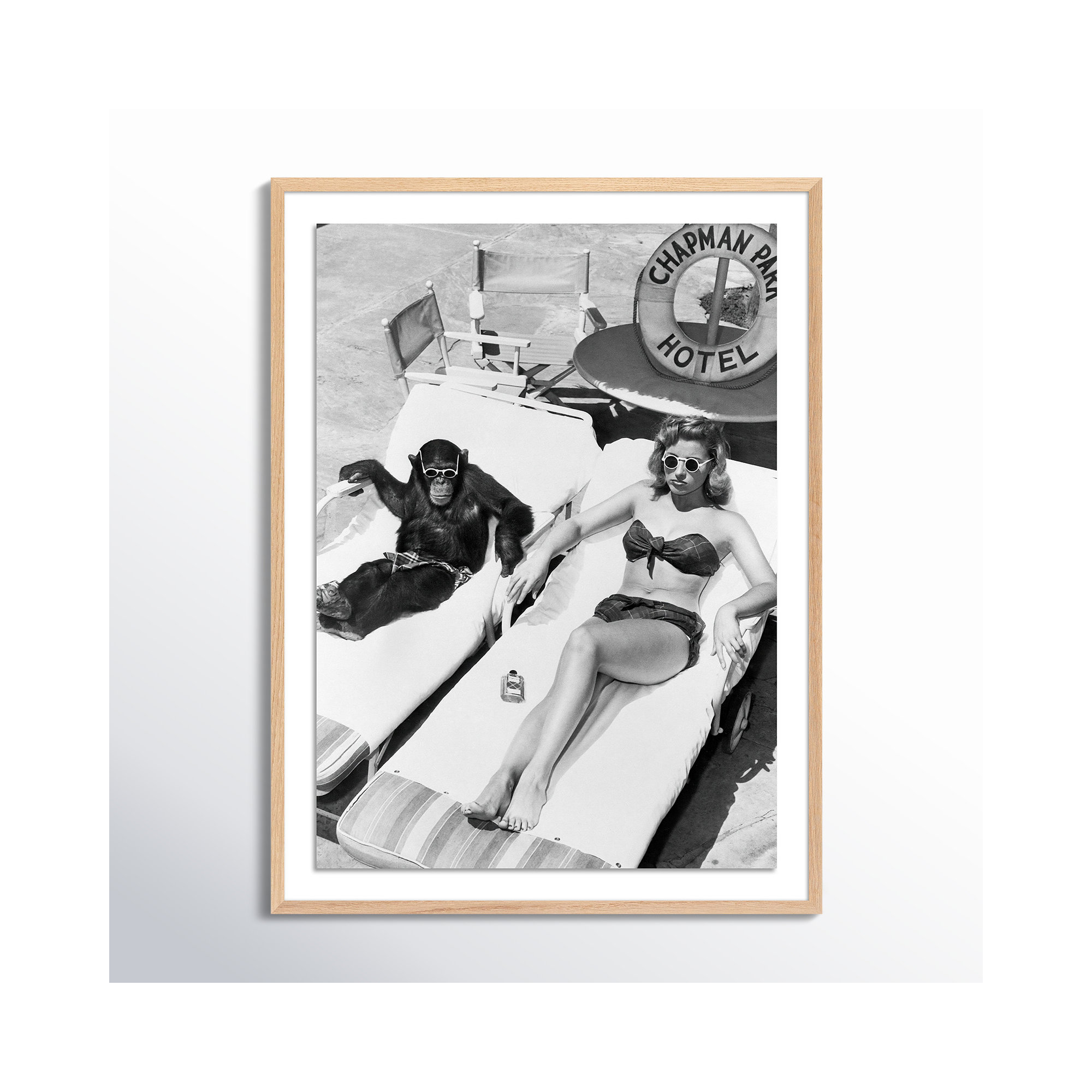 Woman Sunbathing With Chimpanzee by Getty Images, 32" H x 24" W, White Oak Framed