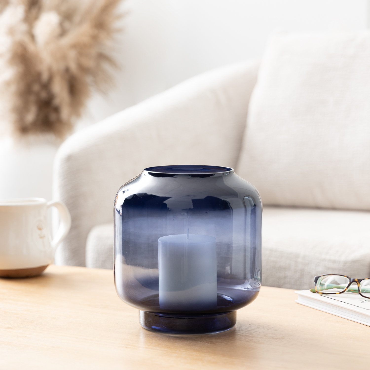 Cole and Grey Glass Wide Clear Room Hurricane Lamp with Elevated Base, Blue, 8.5" H x 8" W x 8" D