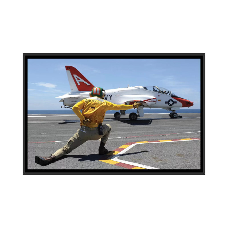 " Shooter Signals To A T-45C Goshawk As It Launches From USS George HW Bush " by Stocktrek Images, 18" H x 26" W x 1.5" D