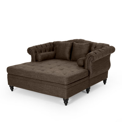 Chaise longue capitonnée avec accoudoirs roulés et garniture cloutée Lamm