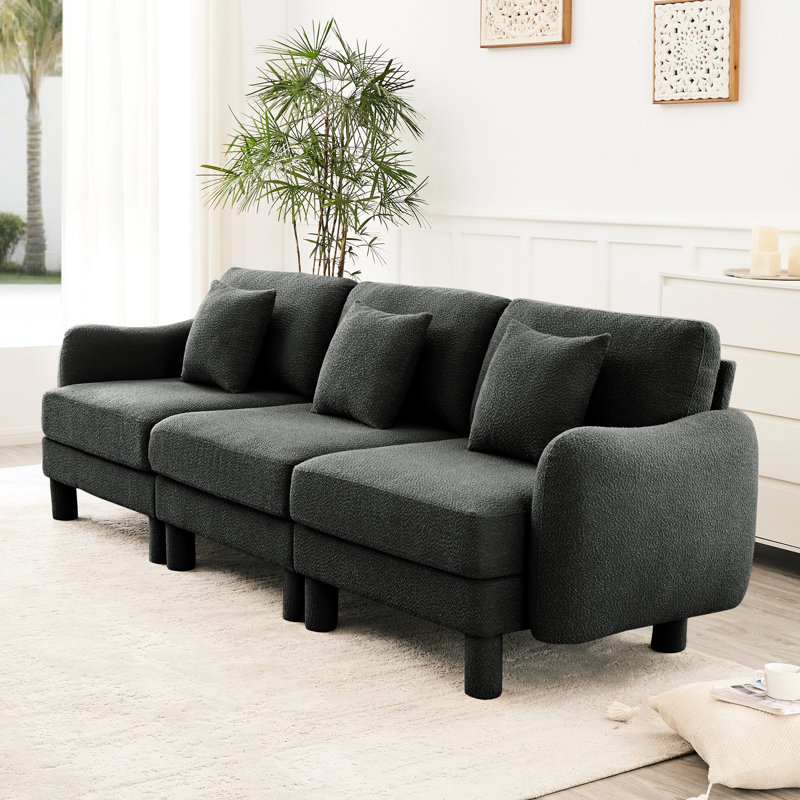 Canapé 3 places en tissu bouclé gris foncé avec des pieds cylindriques élégants et auto-enveloppés, un design moderne pour un style confortable, une fabrication durable, un système de ressorts à siège en forme de coquillage distinctif