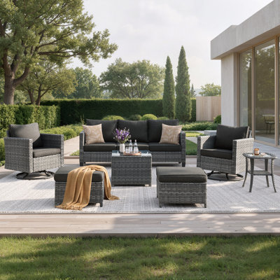 7-Piece Outdoor Wicker Patio Conversation Set with Swivel Rocking Chairs, Ottomans, Cushions & Glass Coffee Table
