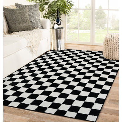 Tapis noir à motif géométrique Carpenter