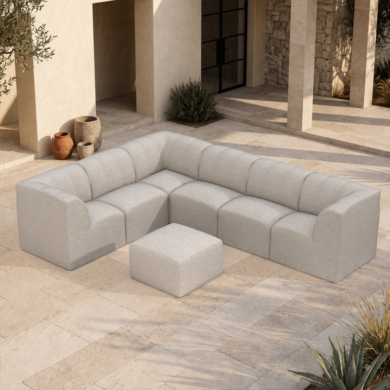 Canapé modulaire rembourré en L avec repose-pieds et coussins Sunbrella 7 pièces Praia, Argent coulé Sunbrella®