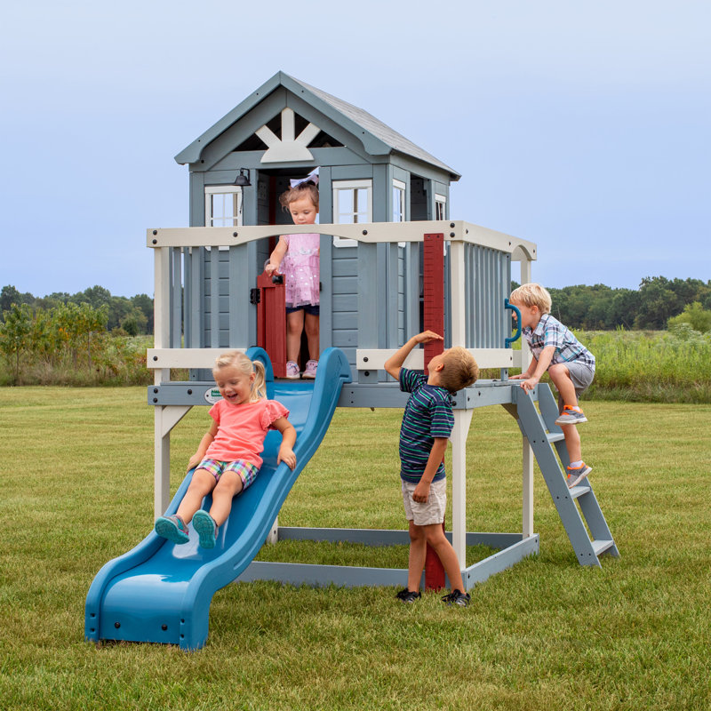Backyard Discovery Beacon Heights Cedar Wooden Elevated Kids Playhouse with Wave Slide, Play Kitchen, and Deck