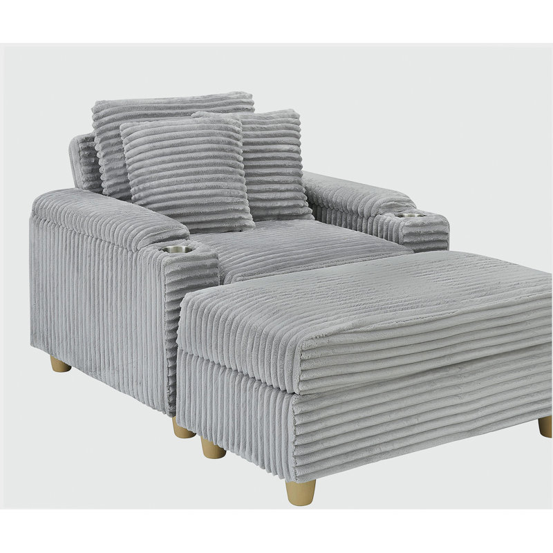 Canapé simple en velours côtelé gris avec un coussin, deux coussins, un repose-pieds et deux espaces de rangement.