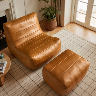 Fauteuil à billes en similicuir avec repose-pieds