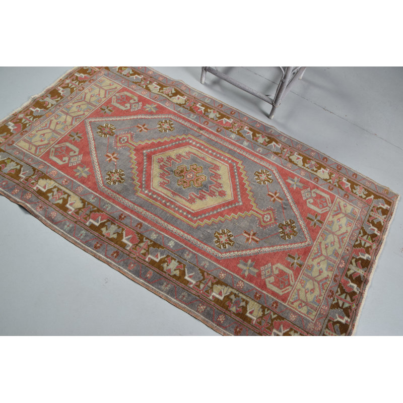 Traditional Turkish Handwoven Area Rug with Geometric Patterns in Vibrant Red and Olive Hues
