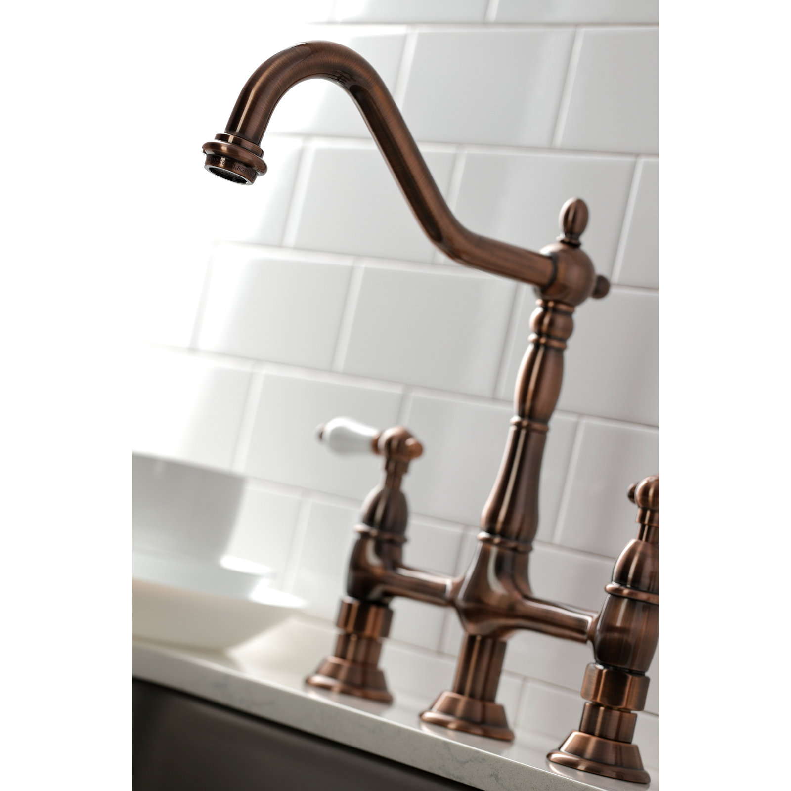 Kingston Brass Heritage Two-Handle 4-Hole Deck Mount Bridge Kitchen Faucet with Brass Side Sprayer, Antique Copper