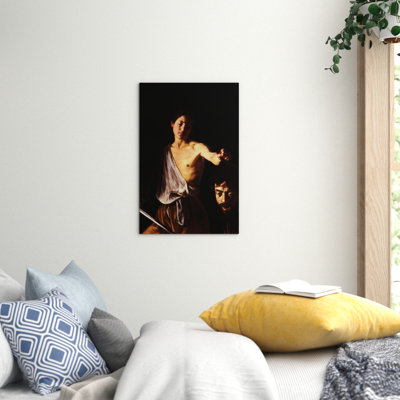 David with the Head of Goliath by Caravaggio - Wrapped Canvas
